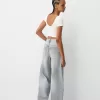Camiseta espalda abierta con pedrería