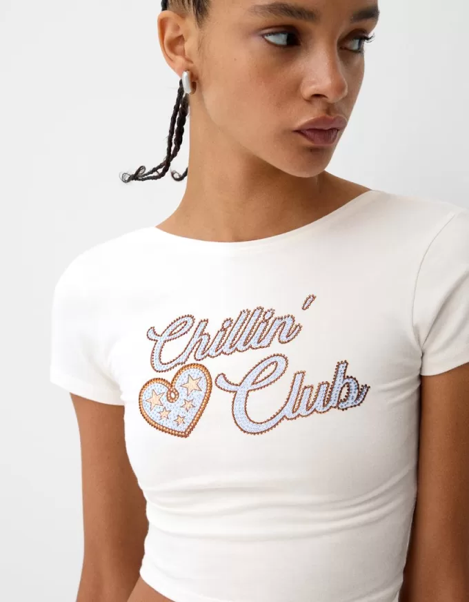 Camiseta espalda abierta con pedrería