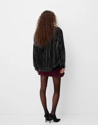 Cazadora bomber con efecto brillante y sobreestampado