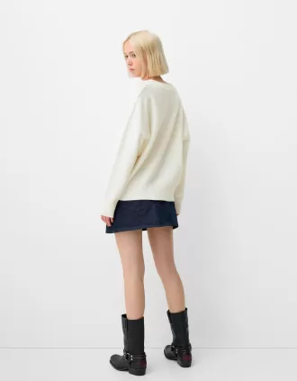 Jersey oversize con cuello de pico