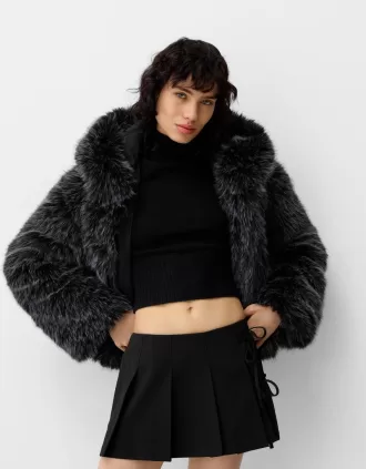 Minifalda con pliegues y detalle de lazo