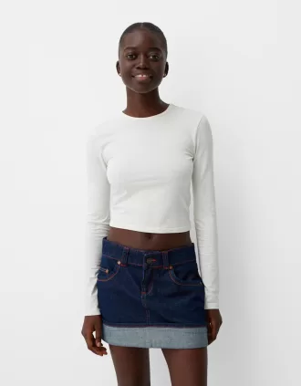 Minifalda denim con vuelta