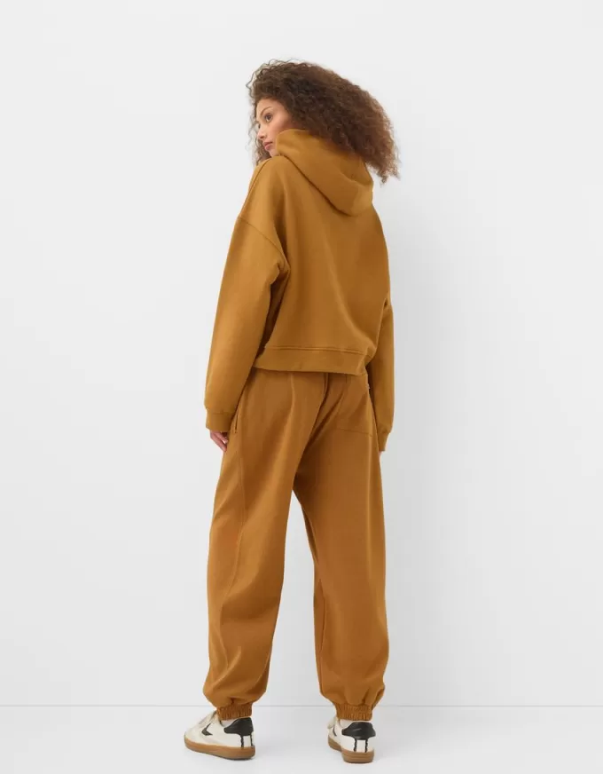 Pantalones jogger voluminosos interlock