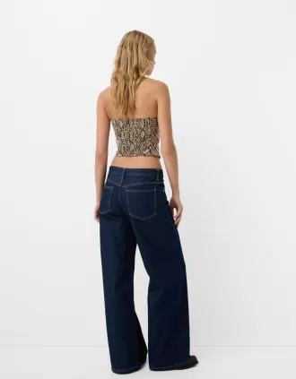 Top de inspiración corsetería efecto piel con estampado animal